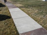 Sidewalk with bacterial stain, before and after